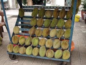 A display rack of durians for sale by a street vendor in Kuala Lumpur.